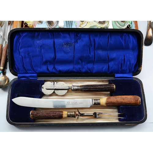 A stainless steel and horn carving set, with embossed silver band