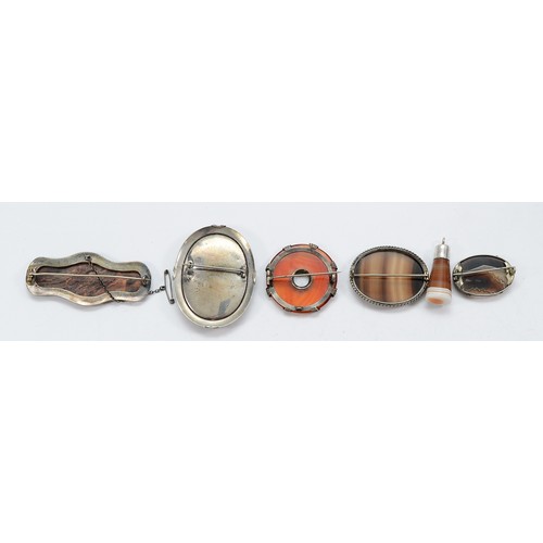 24 - A silver Laughing Cavalier brooch, four unmarked silver agate brooches and an unmarked silver agate ... 