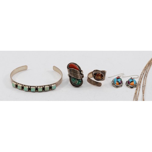 49 - Two 925 silver gemset rings, K-P, a silver bear paw necklace, a silver gemet cuff bangle, a pair of ... 