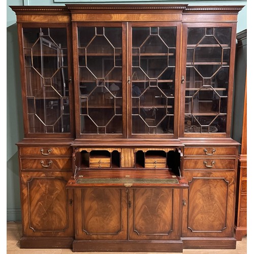 A Bevan Funnell Reprodux Georgian style flame mahogany breakfront library secretaire bookcase, four astragal glazed doors below a projecting moulded cornice, the lower section with central secretaire drawer flanked by two drawers, above four cupboard doors each enclosing shelves, with brass swan neck handles, raised on a shaped plinth base, W196, H216, D48cm.