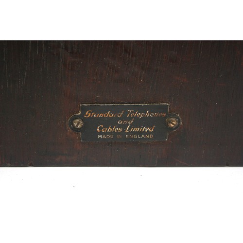21 - A wooden cased signal box shelf telephone and a black Bakelite internal office telephone- both with ... 