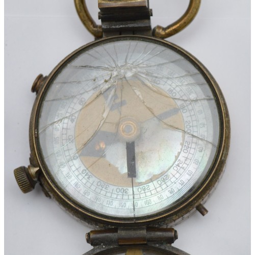 A collection of six 20th century compasses, to include a 1910 dated ...