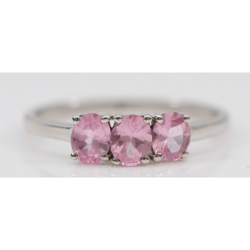 14 - A TGGC 9ct white gold pink sapphire three stone ring, Q, 1.9g