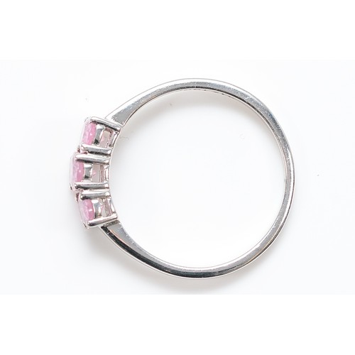 14 - A TGGC 9ct white gold pink sapphire three stone ring, Q, 1.9g