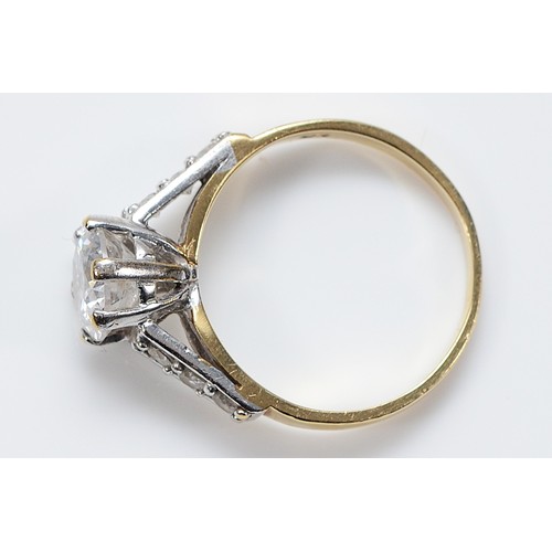 123 - A 9ct gold cubic zirconia solitaire ring with cubic zirconia set shoulders, N 1/2, 3g