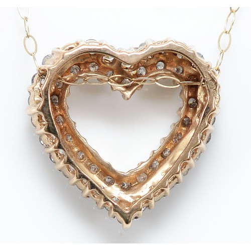137 - A 9ct gold brilliant cut diamond heart shaped pendant on a chain, 18mm, 3.2g