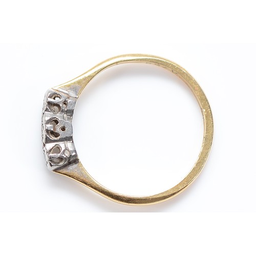 155 - An 18ct gold and platinum three stone diamond ring, K, 1.6g