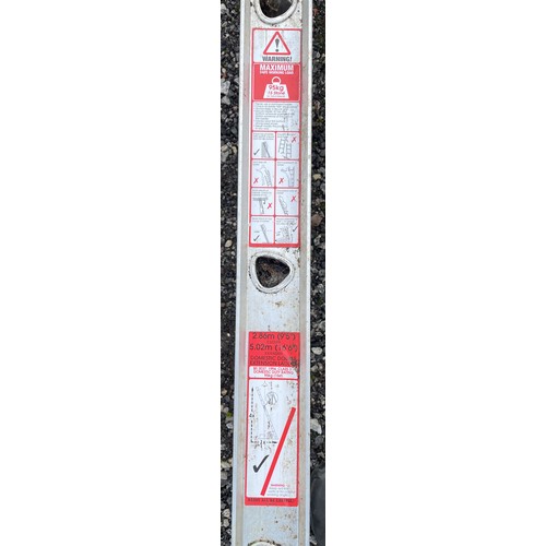 26 - A galvanised domestic double extension ladder (5.02m extended) together with two folding step ladder... 