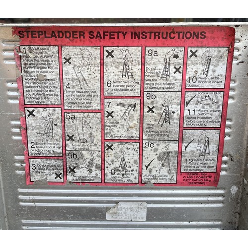 26 - A galvanised domestic double extension ladder (5.02m extended) together with two folding step ladder... 