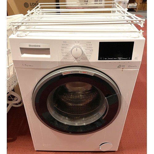 29 - A Bloomberg 7kg 1400rpm washing machine, together with a folding clothes airer. (2)