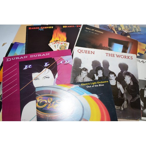 40 - A collection of 39 vinyl LP's to include artists, The Rolling Stones, Electric Light Orchestra, Quee... 