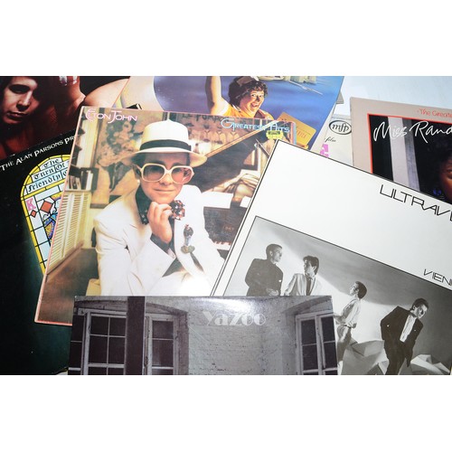 40 - A collection of 39 vinyl LP's to include artists, The Rolling Stones, Electric Light Orchestra, Quee... 