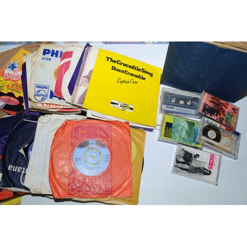 45 - A box of VHS tapes primarily Walt Disney films together with a box of vinyl singles and 78's. (2 box... 