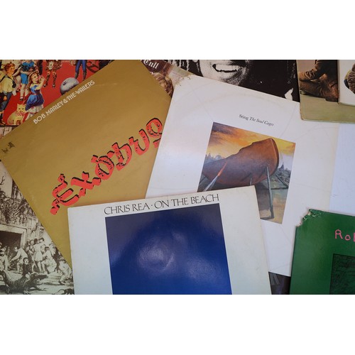 48 - A collection of fifteen vinyl LP's to include artists, Lynyrd Skynyrd, Chris Rea, Jethro Tull, Free ... 