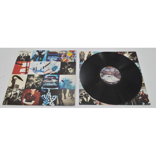 49 - A collection of twelve vinyl LP's to include artists, Free, U2, Frank Zappa and others, please see i... 