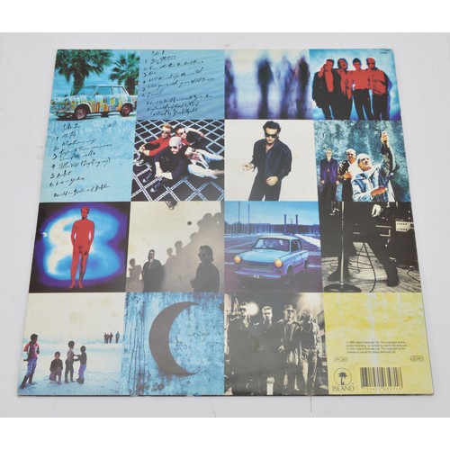 49 - A collection of twelve vinyl LP's to include artists, Free, U2, Frank Zappa and others, please see i... 