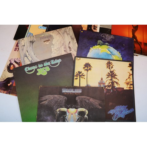 50 - A collection of 16 vinyl LP's to include artists, Yes, Eagles, Jethro Tull and others, please see th... 