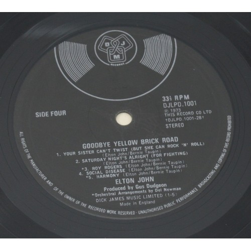 52 - A collection of twelve vinyl LP's to include artists, Queen, Guns n' roses, Elton John and Genesis, ... 