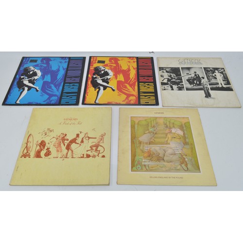 52 - A collection of twelve vinyl LP's to include artists, Queen, Guns n' roses, Elton John and Genesis, ... 