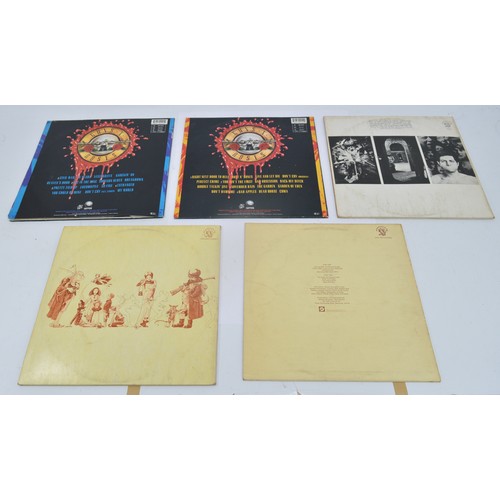 52 - A collection of twelve vinyl LP's to include artists, Queen, Guns n' roses, Elton John and Genesis, ... 