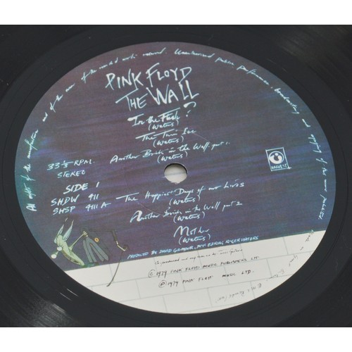 53 - A collection of ten rock vinyl LP's to include Pink Floyd, Meat Loaf, Rolling Stones, AC/DC and Carp... 