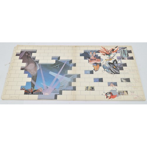 53 - A collection of ten rock vinyl LP's to include Pink Floyd, Meat Loaf, Rolling Stones, AC/DC and Carp... 