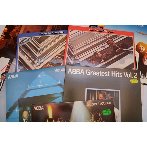 60 - A collection of twelve vinyl LP's to include artists, ABBA, The Beatles, Blondie and others, please ... 