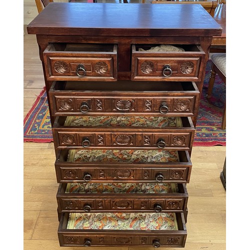 A 20th century carved oak Wellington chest of drawers, in the French ...
