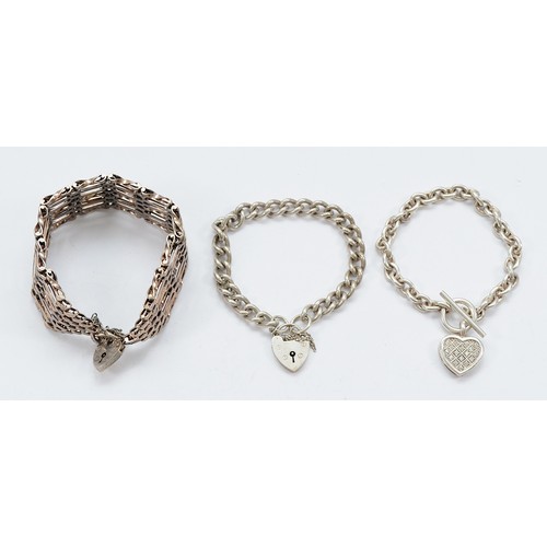 65 - A 925 silver gemset curb link bracelet with heart tag, with two silver bracelets with heart padlock ... 