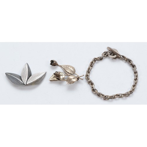 67 - Anton Michelsen, a Danish silver leaf brooch, a John Lauritzen Danish silver floral brooch and a Dan... 