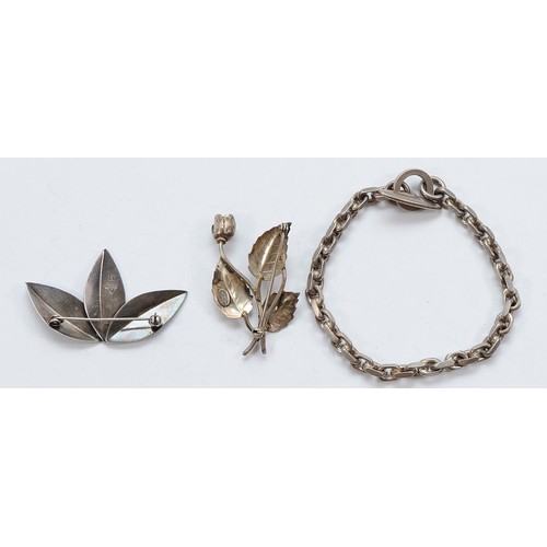 67 - Anton Michelsen, a Danish silver leaf brooch, a John Lauritzen Danish silver floral brooch and a Dan... 