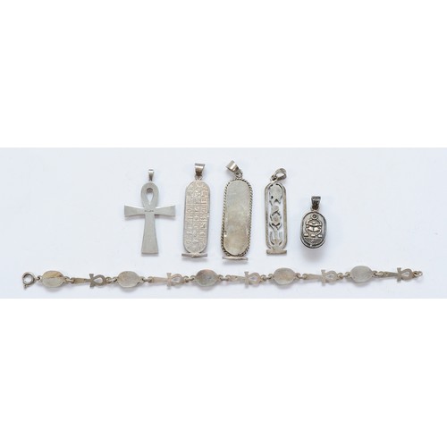 69 - Four Egyptian silver pendants, an Egyptian silver bracelet and a silver pendant, 40g