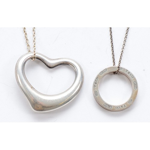 73 - Tiffany & Co, a 925 silver Elsa Peretti heart pendant on a chain, with a Tiffany & Co 925 silver cir... 