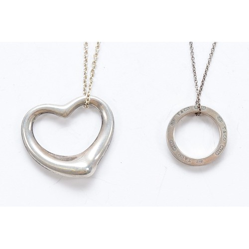 73 - Tiffany & Co, a 925 silver Elsa Peretti heart pendant on a chain, with a Tiffany & Co 925 silver cir... 