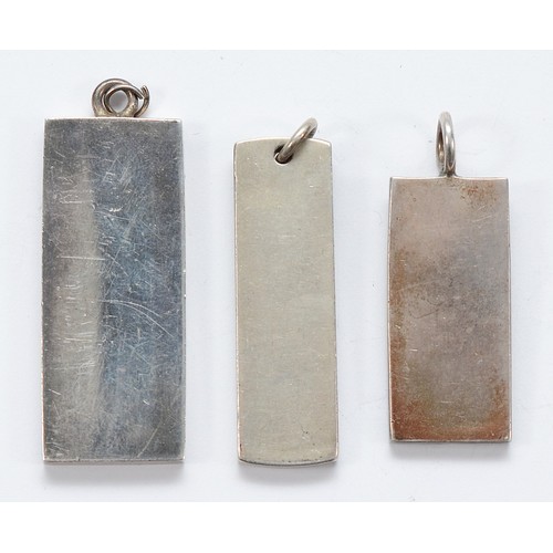 97 - Two silver ingot pendants, Birmingham 1977, with a silver ingot pendant, London 1977, 62g