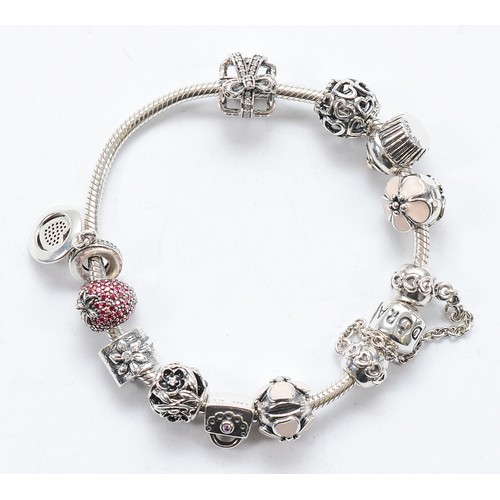 113 - Pandora, a silver charm bracelet with eleven charms, 46g
All have the 925 ALE hallmark