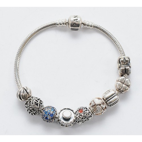114 - Pandora, a silver charm bracelet with nine charms, 40g
All have the 925 ALE hallmark