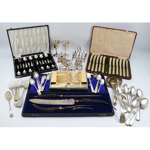 219 - Eleven matching silver handled butter knives, Birmingham 1912, together with two Italian silver plat... 