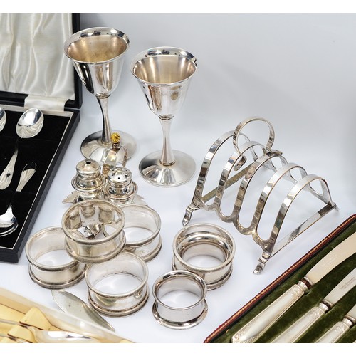 219 - Eleven matching silver handled butter knives, Birmingham 1912, together with two Italian silver plat... 