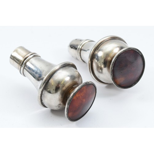 221 - A pair of silver salt and pepper pots, Birmingham 1933, on a rounded faux tortoiseshell base, 8cm, l... 