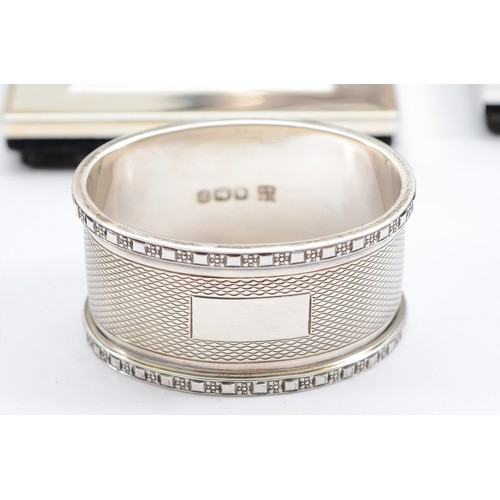 223 - A silver oval napkin ring, Sheffield 1969, 46gm, together with a three piece tea set, compromising o... 
