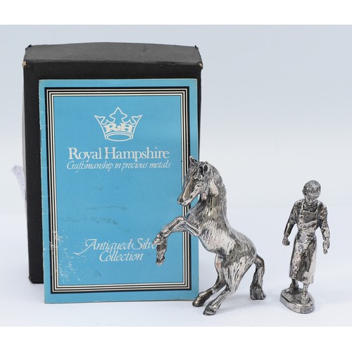 227 - Royal Hampshire, a silver model of a farrier, together with a silver rearing horse, stamped 'RH' fil... 