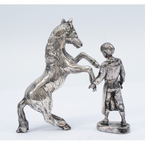 227 - Royal Hampshire, a silver model of a farrier, together with a silver rearing horse, stamped 'RH' fil... 