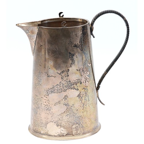 228 - A silver pitcher, Chester 1915, by the Barker Brothers, having a tapered cylindrical body, and a wic... 