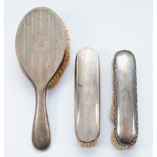 234 - A silver dressing table hair brush, Chester 1919, with engraved 'A' to the back together with a matc... 