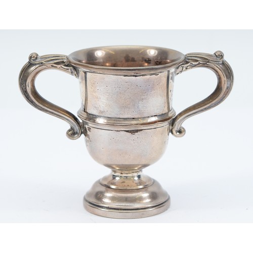 A silver twin handled cup, Sheffield 1948, by Walker & Hall, 77gm, 8cm. 

Condition - silver worn through to one side.
