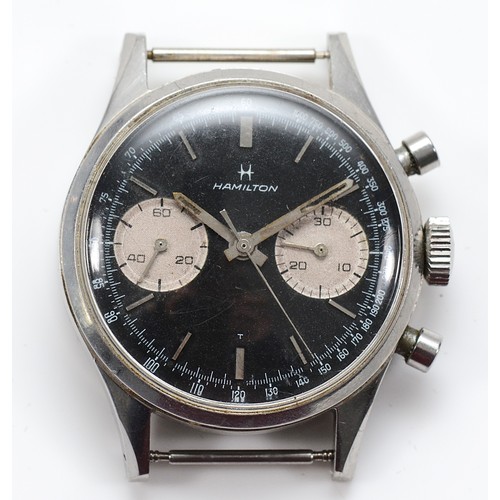 Hamilton, a stainless steel chronograph manual wind gentleman's wristwatch, c.1966, black dial with baton markers, two silvered dials for seconds and 30-minute register, outer fifth of seconds track, buttons in the band to operate chronograph, signed MN, cal. L 248, case serial number 471126, 35mm.
Purchased by our vendor in 1966, in good original condition, top button starts, bottom stops and resets.