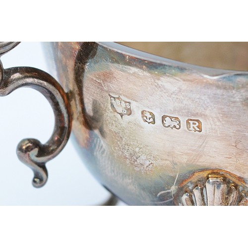 66 - A silver milk jug, Birmingham 1941, by S Blanckensee & Son Ltd, raised on three legs, 141gm, 14x8cm.... 