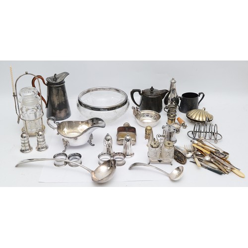 71 - A large quantity of silver plated wares to include, a plated ewer, having wicker handle, a plated gr... 