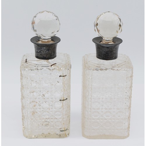 72 - A pair of cut glass decanters with silver collars, Birmingham 1926, by John Grinsell & Sons, one dec... 